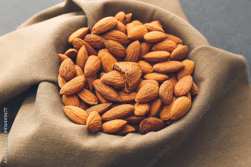 Heap of healthy almonds on table