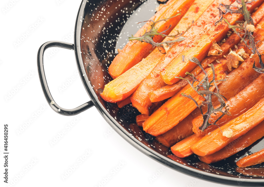 Dish of tasty baked carrot on white background