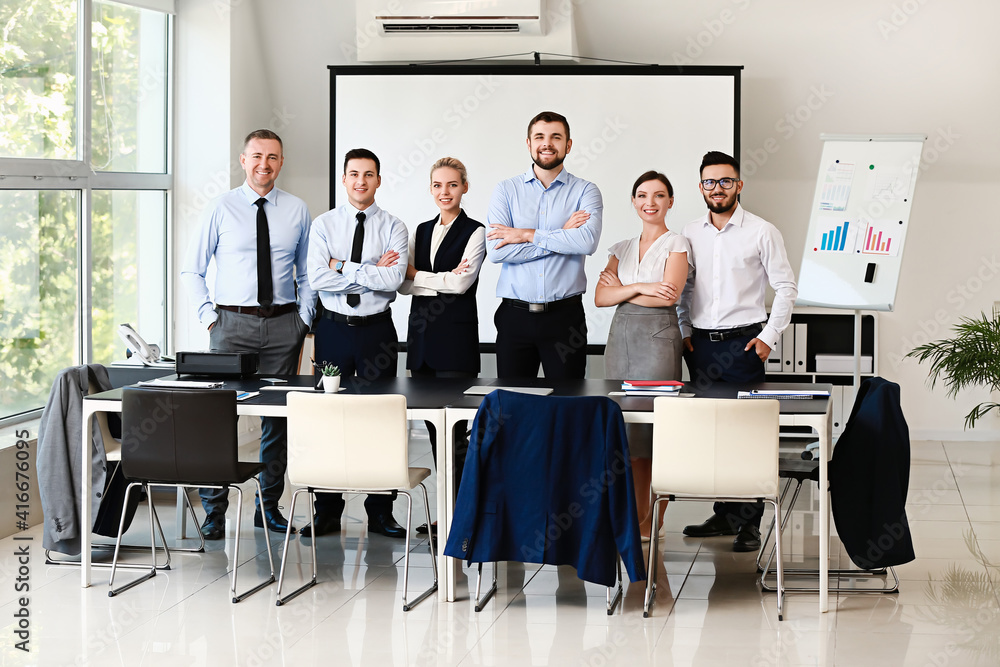 Portrait of business people during meeting in office