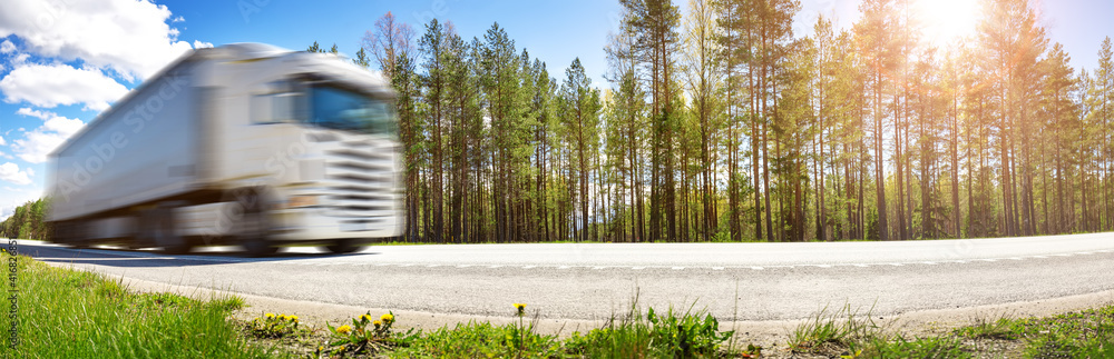 Truck moving on the highway in summer