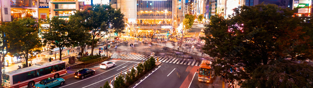 People and traffic cross the famous scramble intersection in Shibuya, Tokyo, Japan, one of the busie