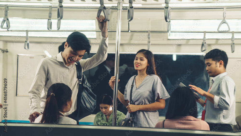 Crowd of people on a busy crowded public subway train travel . Commuting and urban lifestyle concept