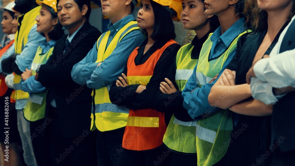 Large group of factory worker standing together in warehouse or storehouse . Logistics , supply chai