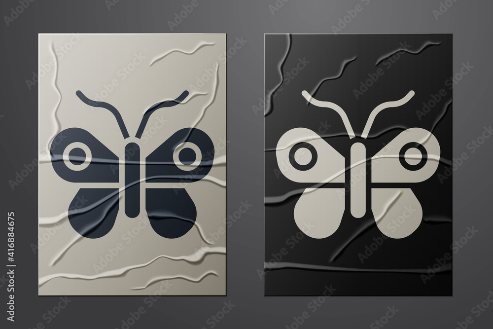 White Butterfly icon isolated on crumpled paper background. Paper art style. Vector.