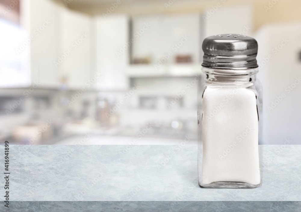 The salt glass bottle on white desk