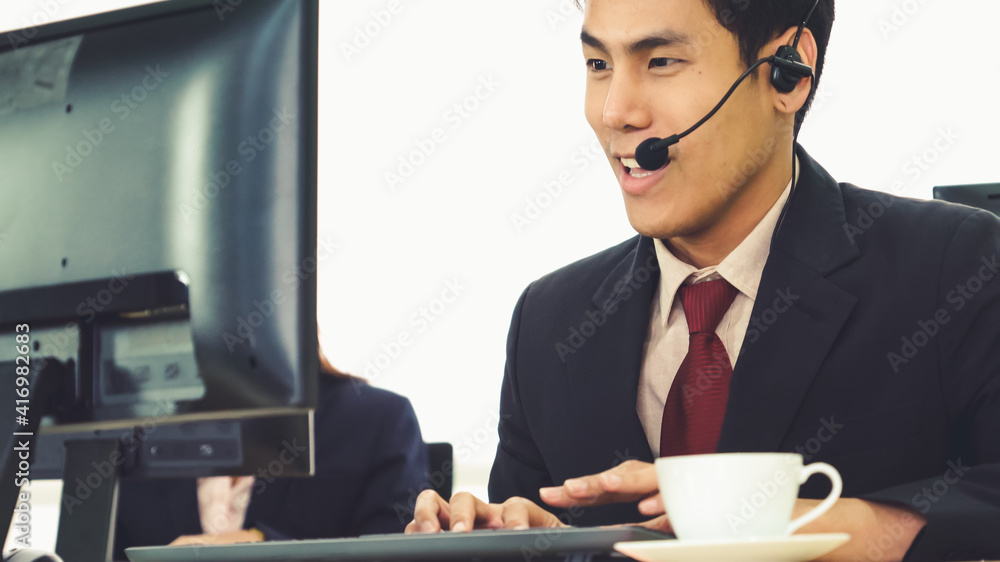 Business people wearing headset working in office to support remote customer or colleague. Call cent