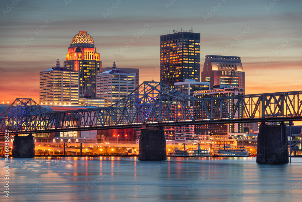 Louisville, Kentucky, USA skyline on the river at dusk.