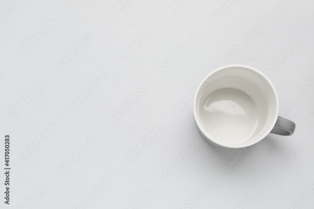 Empty cup on light background