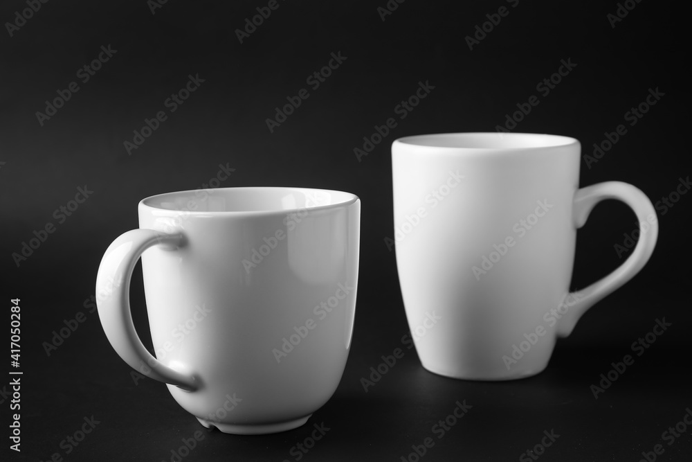 Empty cups on dark background