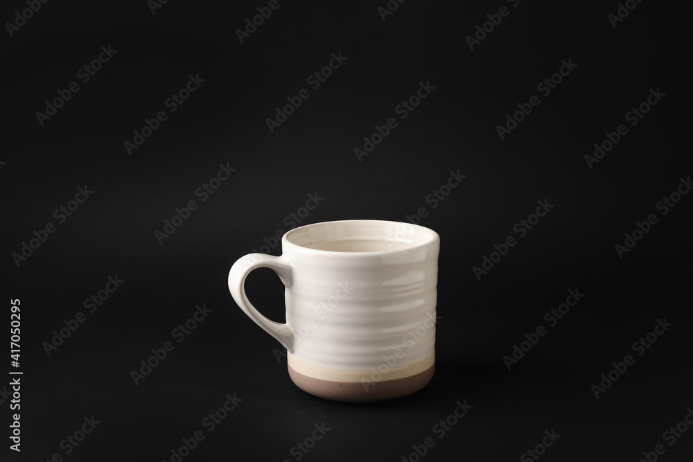 Empty cup on dark background