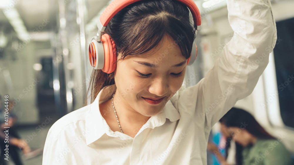 Young woman mobile phone on public train . Urban city lifestyle commuting concept .