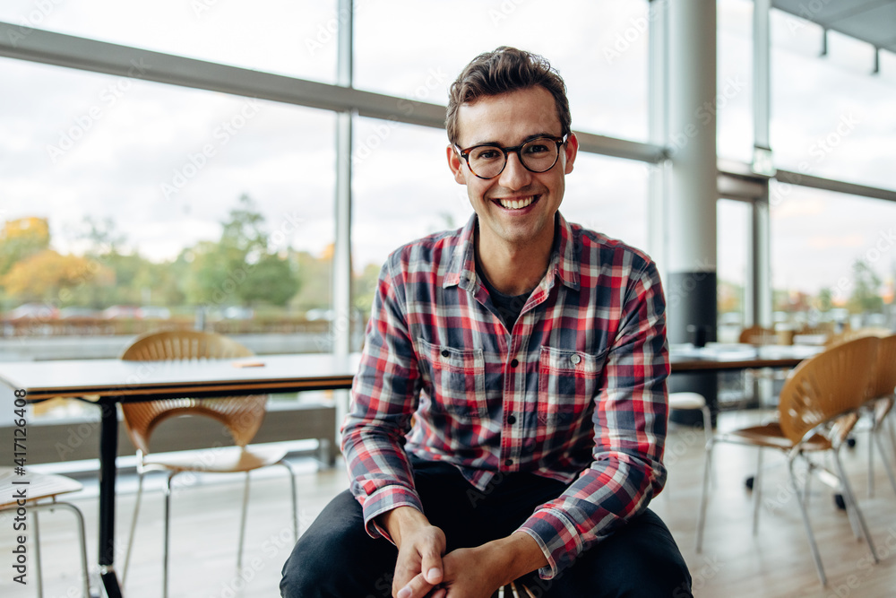 Young business professional smiling at camera