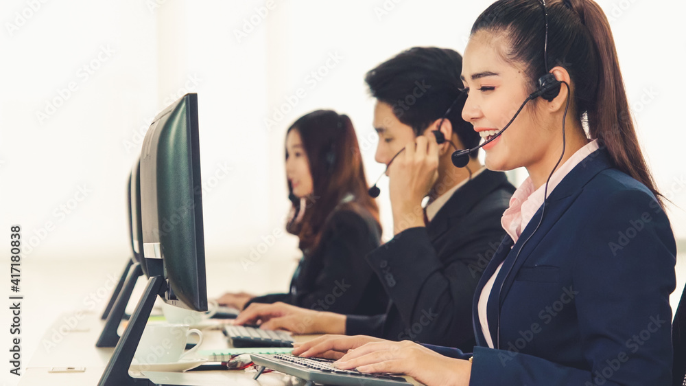 Business people wearing headset working in office to support remote customer or colleague. Call cent