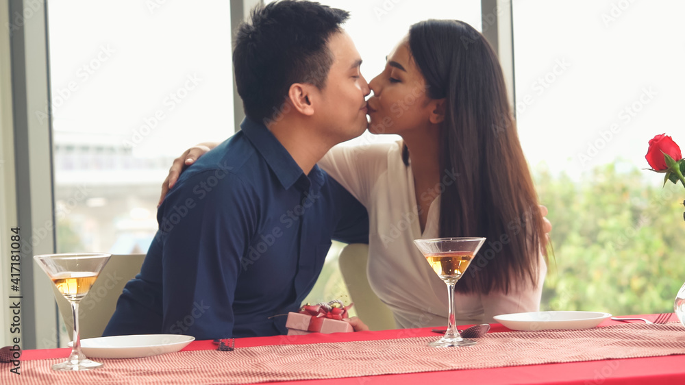 Happy romantic couple eating lunch at restaurant . Couple anniversary celebration and lifestyle .