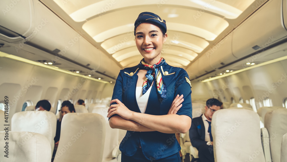 Cabin crew or air hostess working in airplane . Airline transportation and tourism concept.