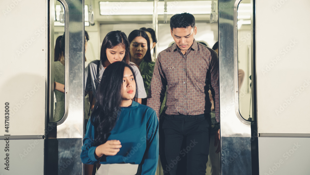 Crowd of people on a busy crowded public subway train travel . Commuting and urban lifestyle concept