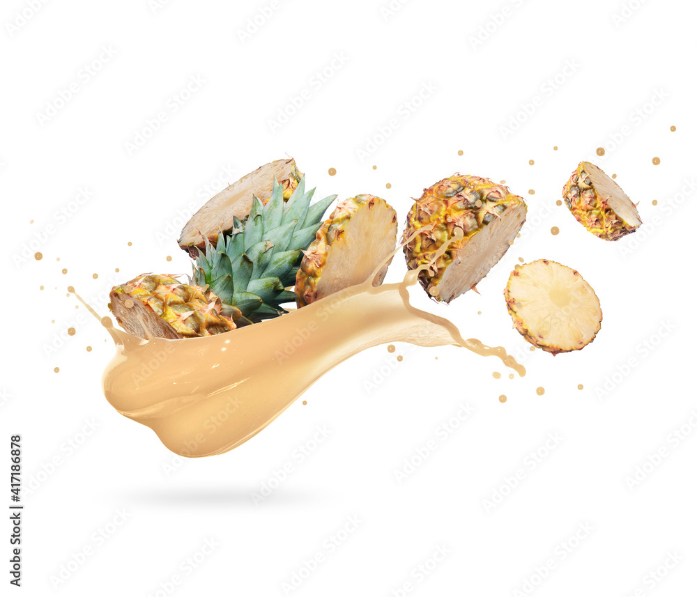 Chopped pineapple with splash of fresh juice on a white background