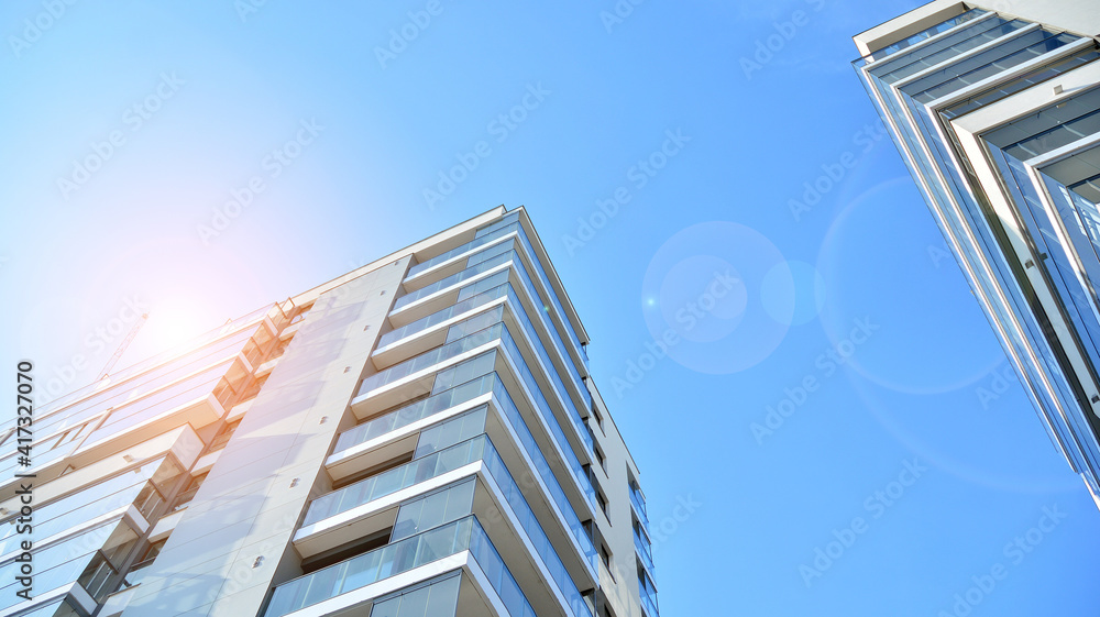 Apartment residential house and home facade architecture and outdoor facilities. Blue sky on the bac