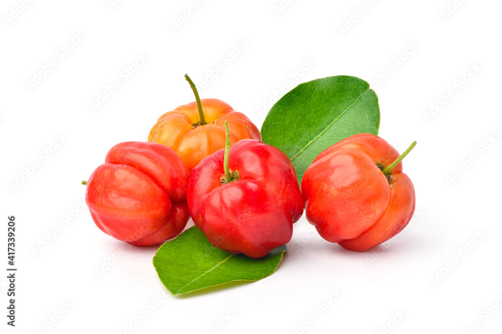  Acerola cherry fruits with green leaves on white background.