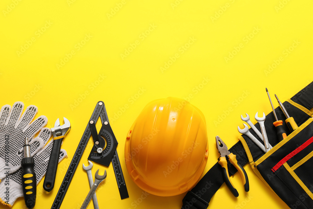 Set of construction tools on color background