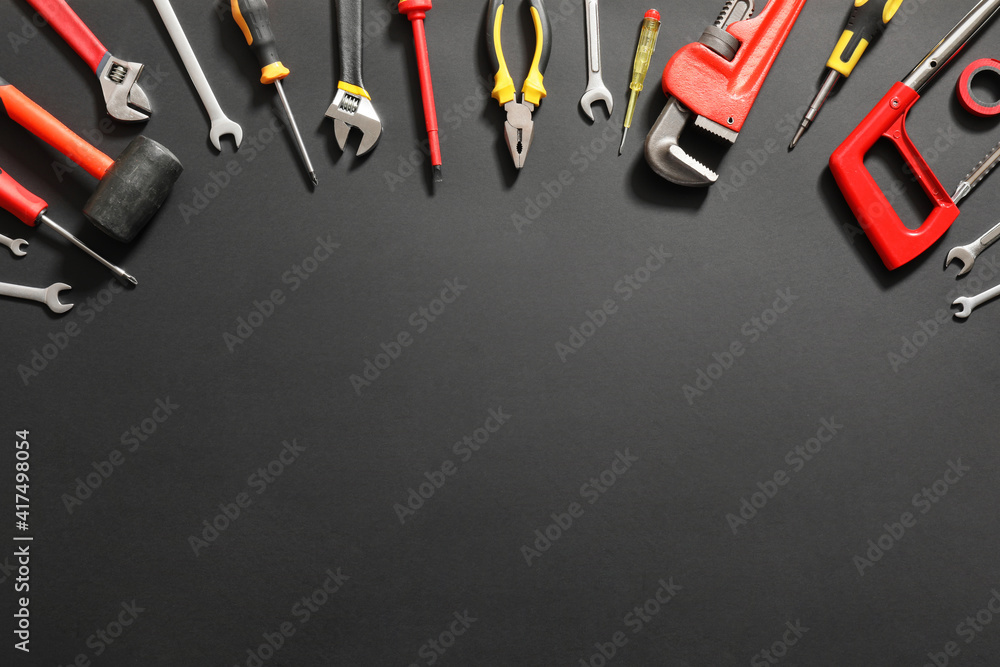 Set of construction tools on dark background