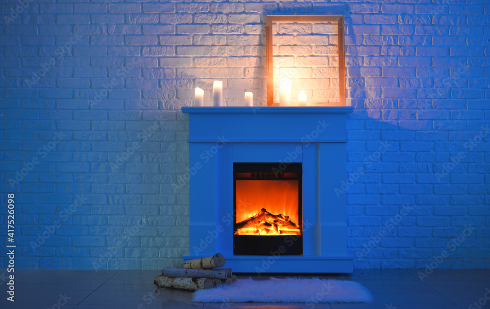 Fireplace near brick wall in living room