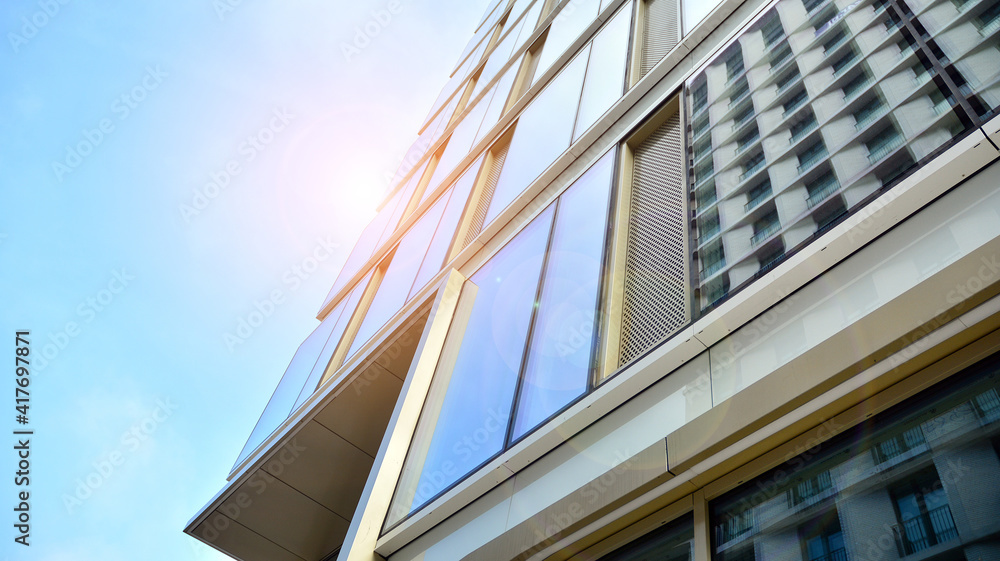 Fragment of glass and metal facade walls. Commercial office buildings. Abstract modern business arch