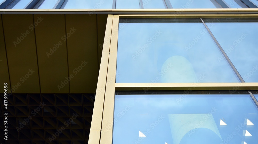 Fragment of glass and metal facade walls. Commercial office buildings. Abstract modern business arch