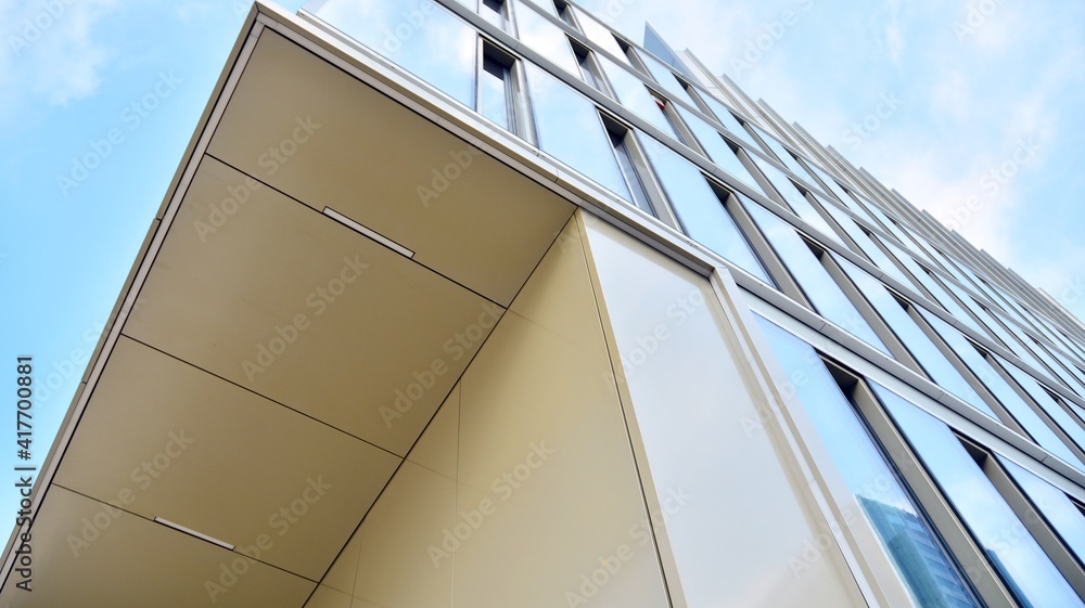 Fragment of glass and metal facade walls. Commercial office buildings. Abstract modern business arch