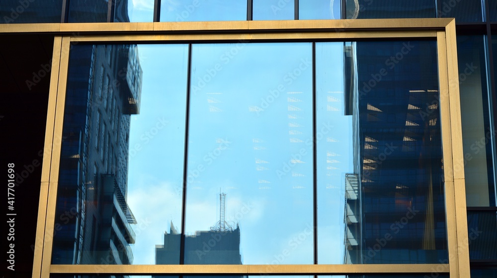 Fragment of glass and metal facade walls. Commercial office buildings. Abstract modern business arch