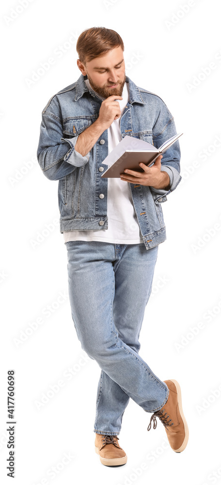 Young man reading book on white background