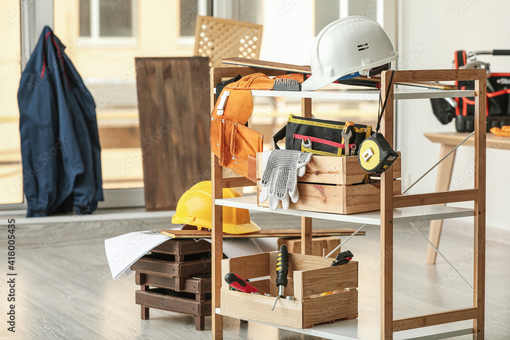 Rack with construction tools in workshop