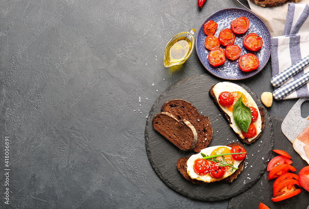 Slate plate with fresh tasty bruschettas on dark background