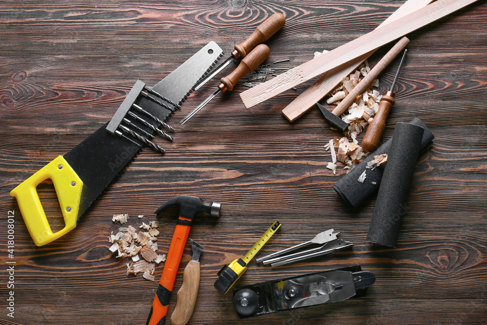 Frame made of carpenters tools and saw dust on wooden background