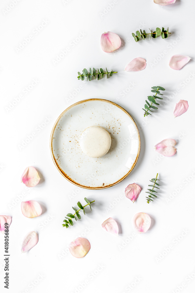 woman breakfast with rose and macaroons white table top view