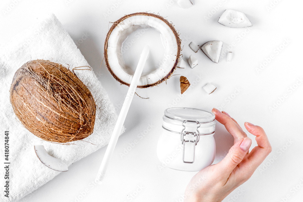 organic cosmetics with coconut on white background top view