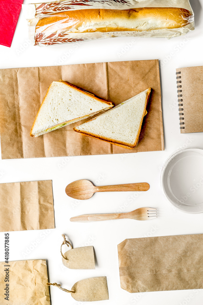 Take away set with paper bags on restourant table background top view