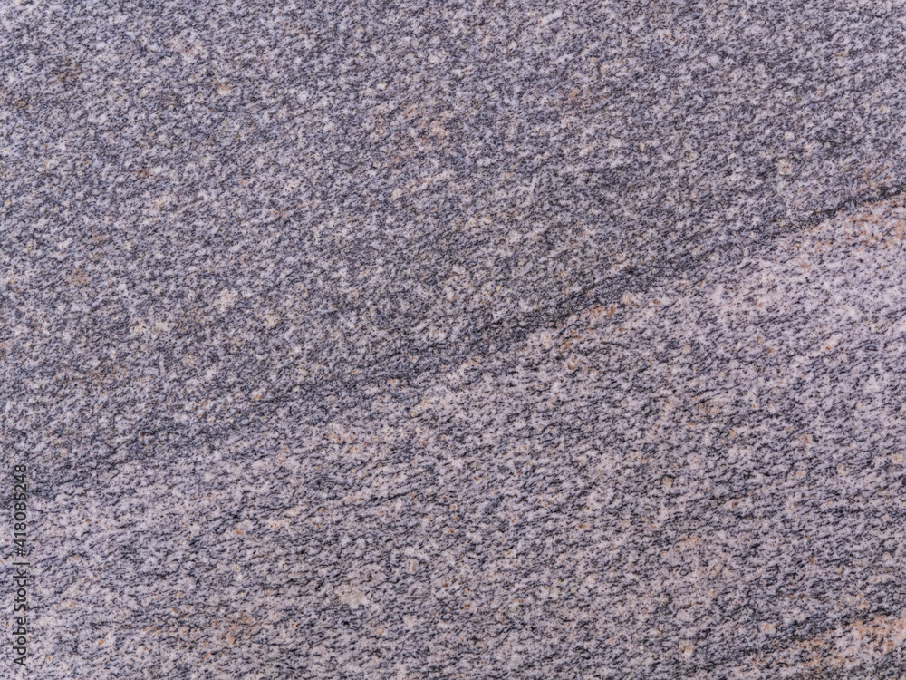 Polished granite slab texture. Stone pattern. Close-up.