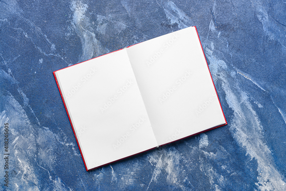 Blank open book on color background