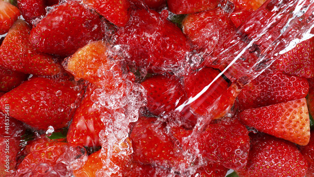 Top view of strawberries with water splashes