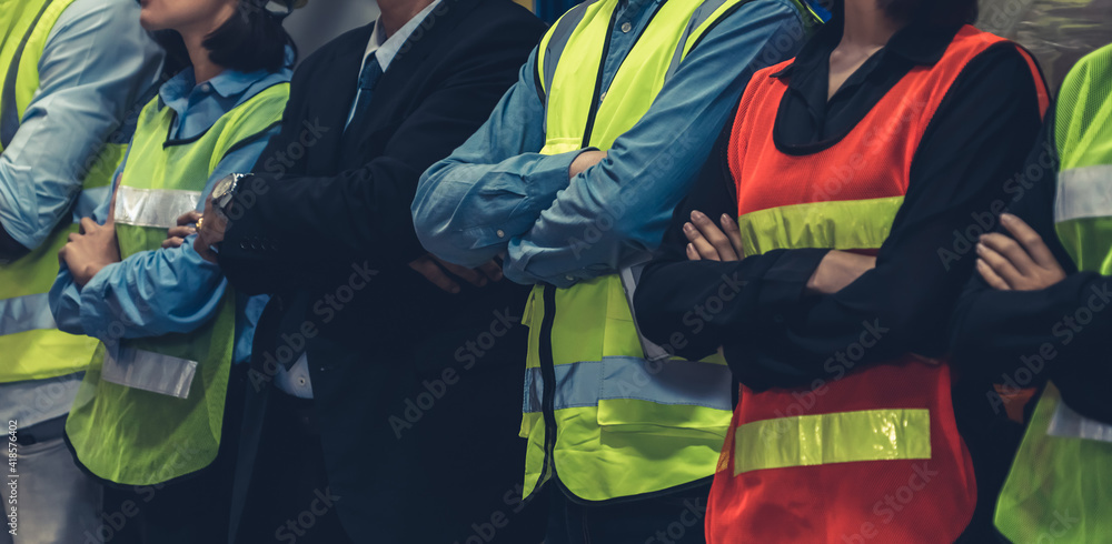 Large group of factory worker standing together in warehouse or storehouse . Logistics , supply chai