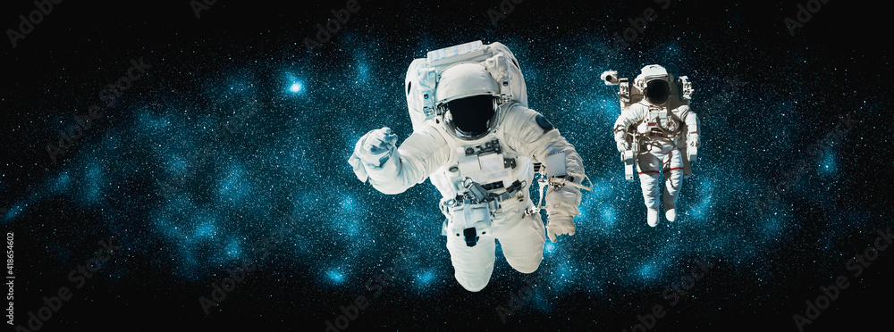 Astronaut spaceman do spacewalk while working for space station in outer space . Astronaut wear full