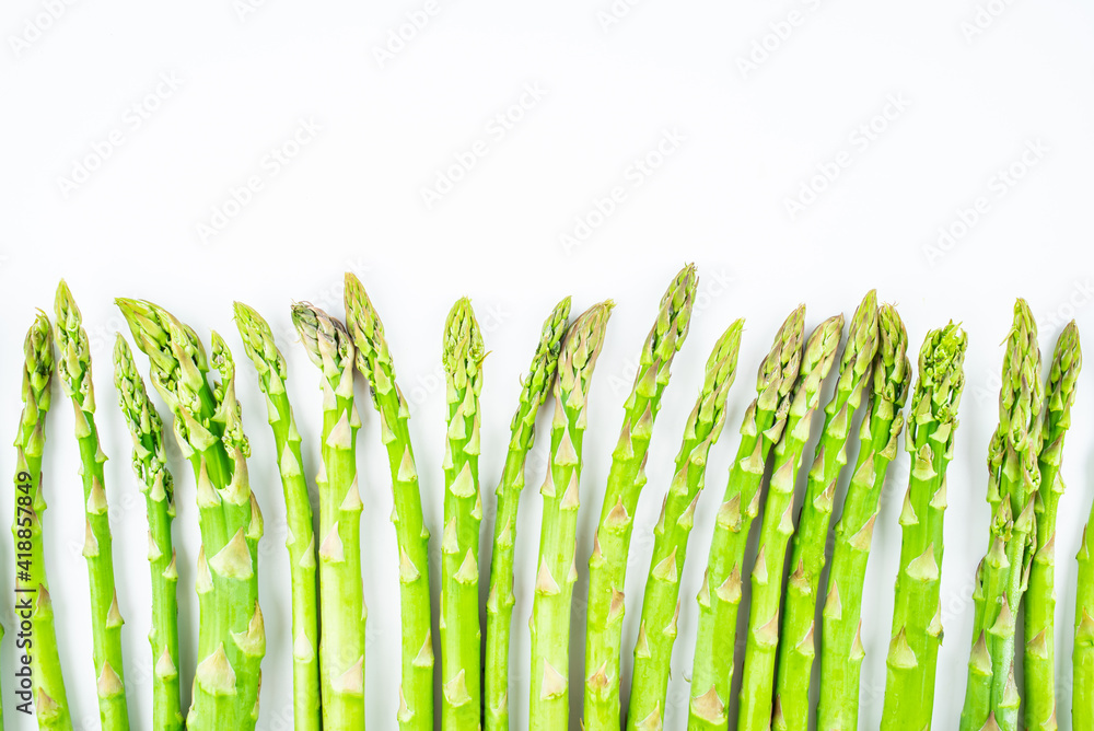 Spring seasonal vegetable asparagus on white background