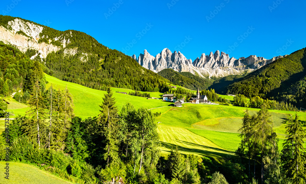 View of Val di Funes with the Chruch of Santa Maddalena in the Dolomites Mountains. UNESCO world her