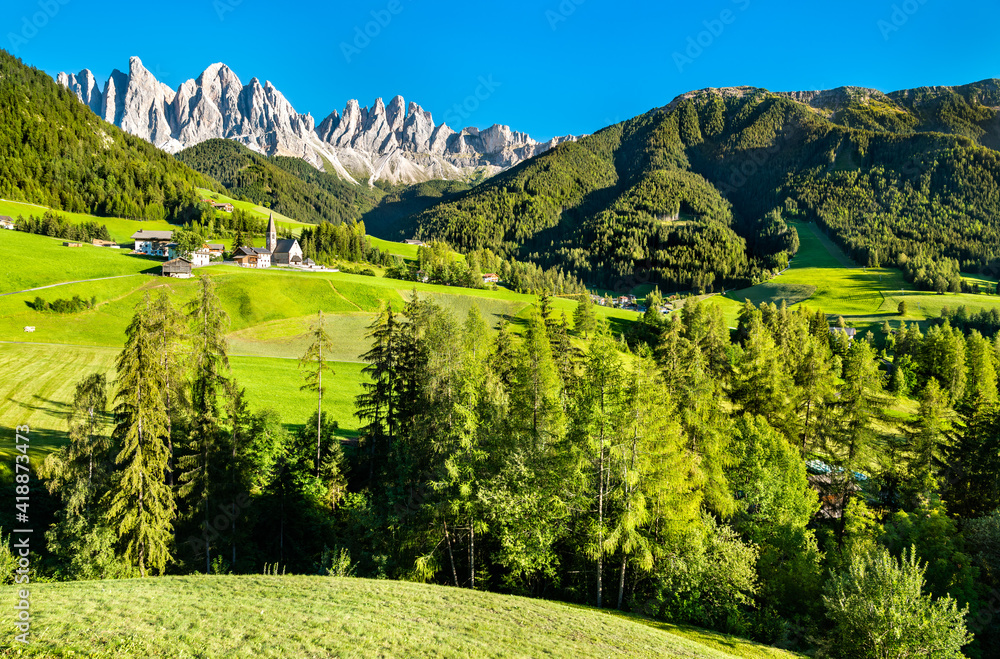 View of Val di Funes with the Chruch of Santa Maddalena in the Dolomites Mountains. UNESCO world her