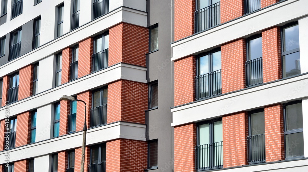 Cityscape with facade of a modern residential building. Modern European residential apartment buildi