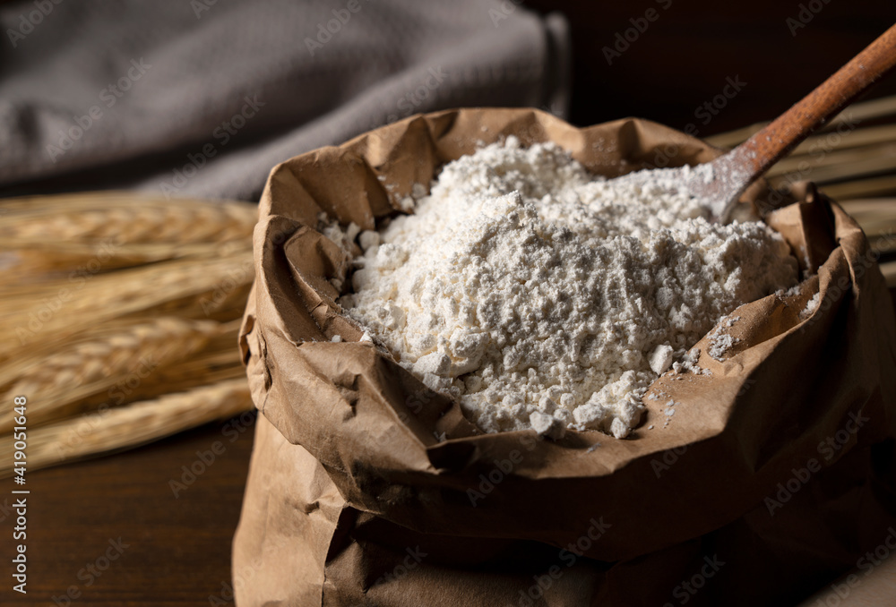 Flour set against a dark wooden background