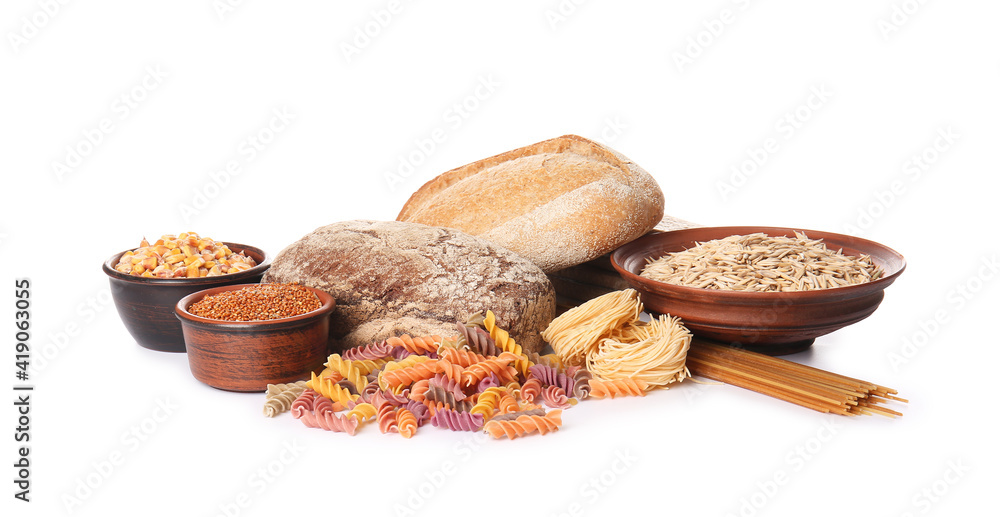 Composition with different cereals, raw pasta and bread on white background