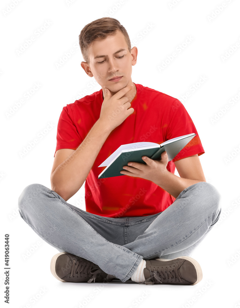 Young man reading book on white background