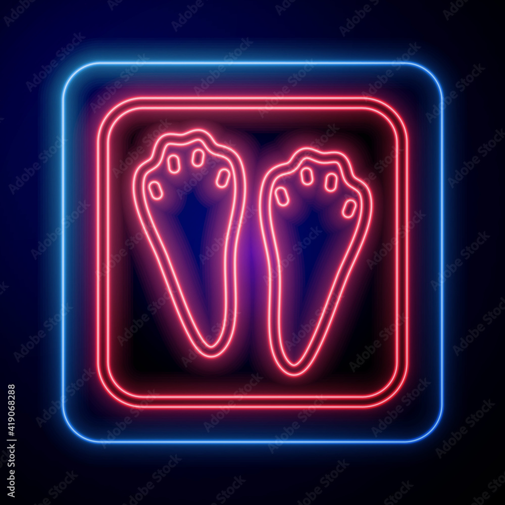 Glowing neon Rabbit and hare paw footprint icon isolated on black background. Vector.